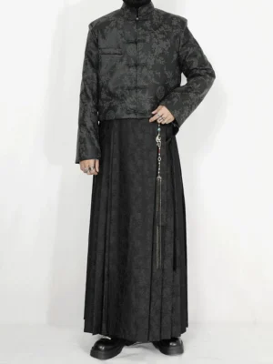 Full front view of black jacquard pleated maxi skirt in a modern New Chinese streetwear outfit with stand collar vest