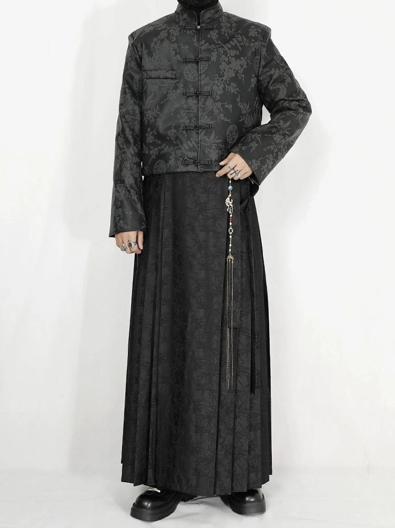 Full front view of black jacquard pleated maxi skirt in a modern New Chinese streetwear outfit with stand collar vest