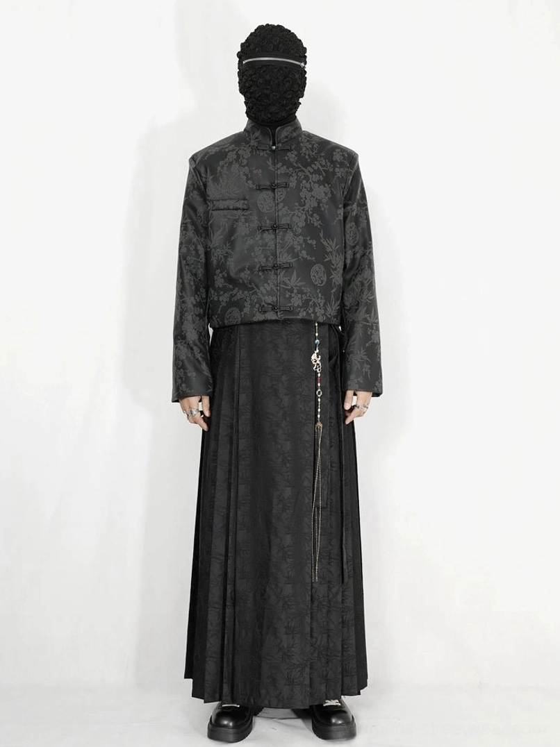 Black tonal jacquard pleated maxi skirt with wrap-inspired waist and floor-length drape