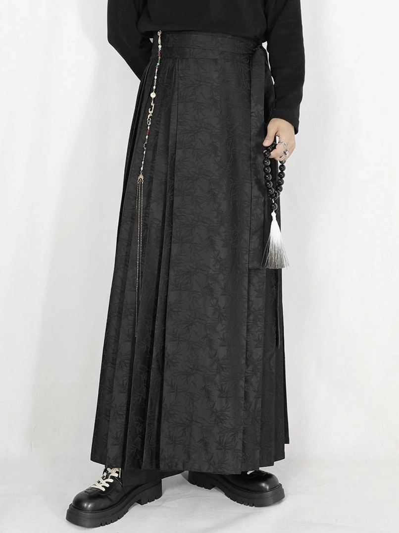 Black tonal jacquard pleated maxi skirt with high waist side tie and long tassel chain detail