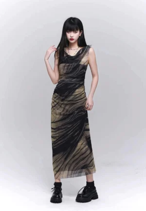 Front full-body view of a black and khaki marble print sheer mesh maxi dress with sleeveless cowl neck, ruched bodycon fit, floor-length hem, and chunky black platform boots
