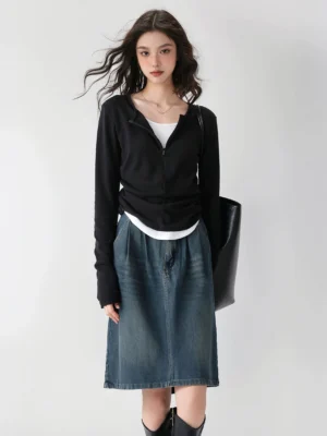 Black Korean streetwear half-zip ribbed knit layered base top styled with denim midi skirt ankle boots and leather tote