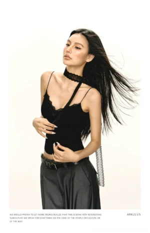 Side view of black lace trim camisole top with asymmetrical spaghetti straps and attached lace choker detail