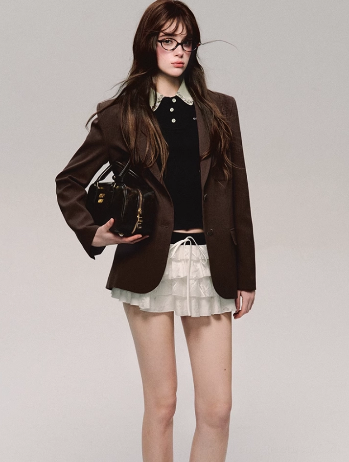 Black lace collar cropped polo top with puff sleeves styled with a brown blazer and tiered ruffle mini skirt