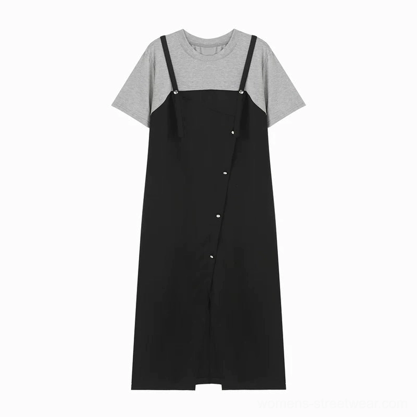 Flat lay view of a black layered tee pinafore midi dress with grey short-sleeve base tee and diagonal button placket
