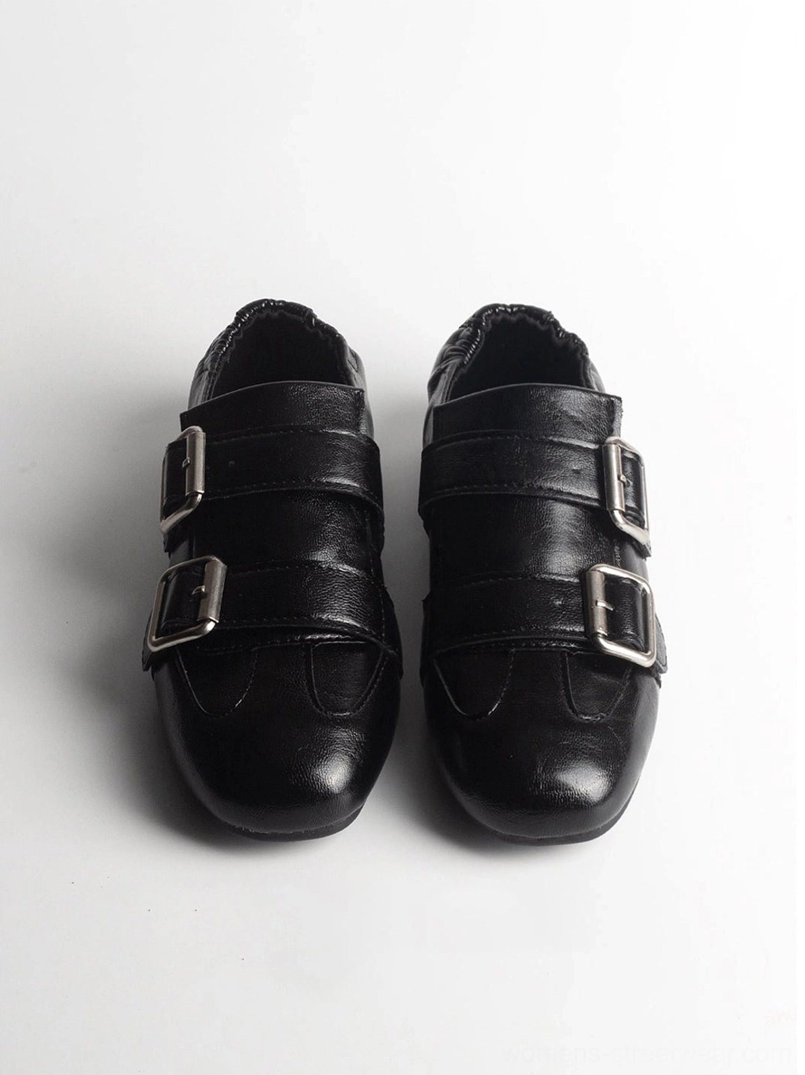 Black leather double-buckle loafer flats pair with sleek softly squared toe silhouette