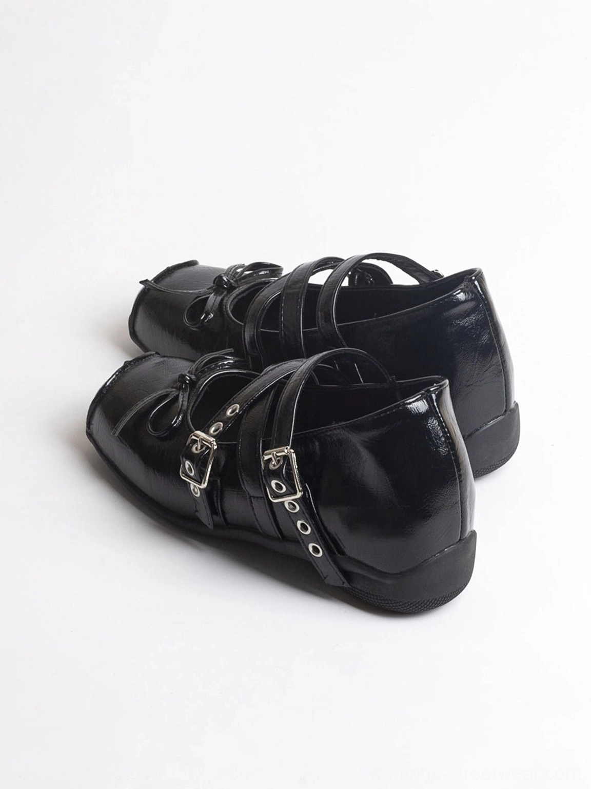 Black leather double-strap Mary Jane flats with square toe and silver buckle details shown from above