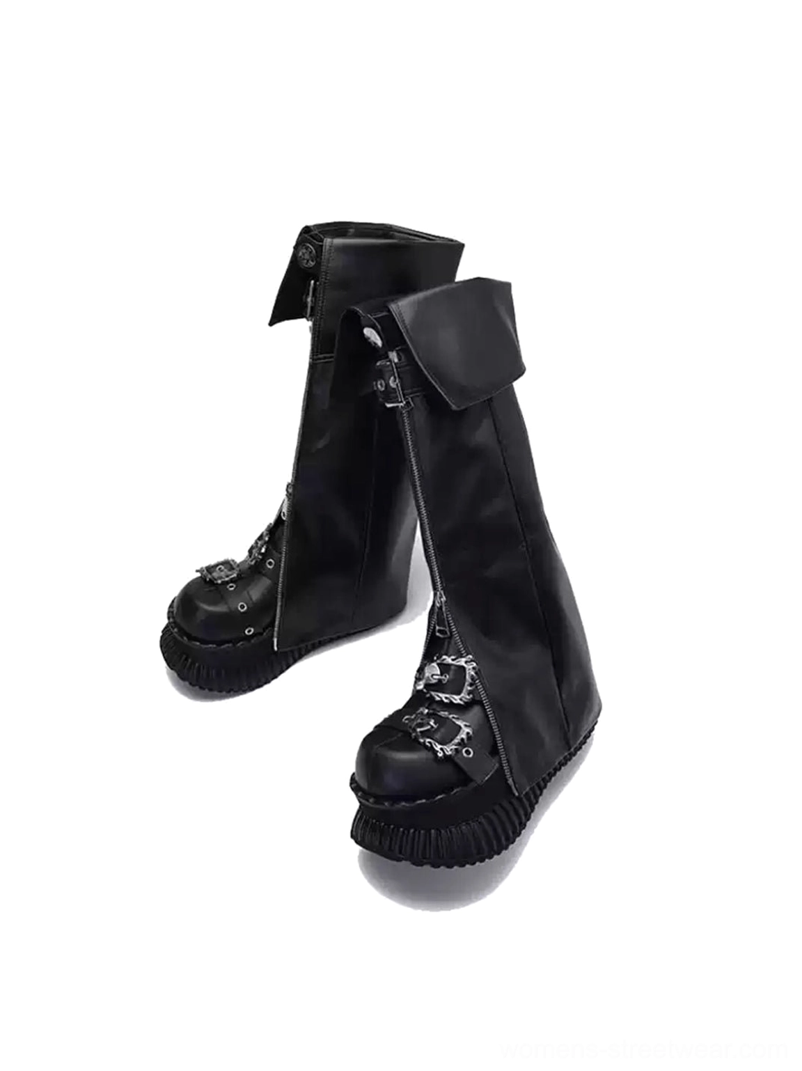 Three quarter front view of black leather foldover platform knee-high boots with front zipper, buckle, chain detail, and lug sole