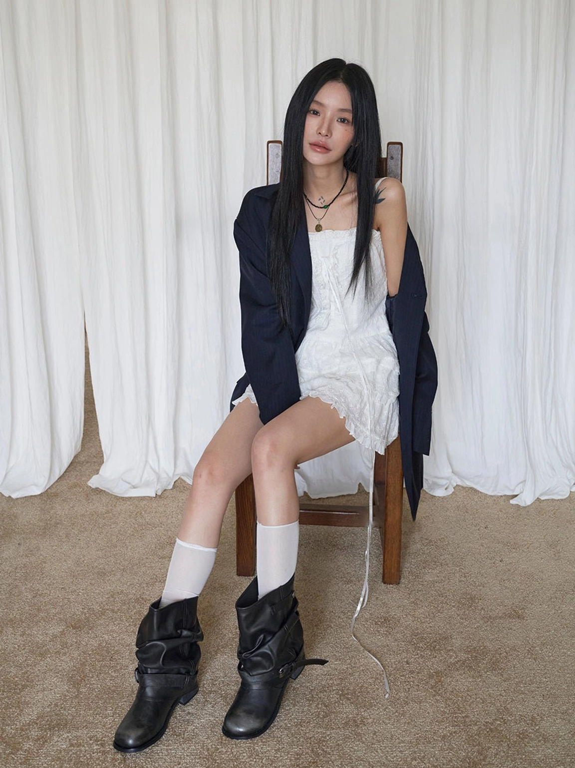 Black leather-look ruched streetwear boots with low block heel and decorative buckle accent