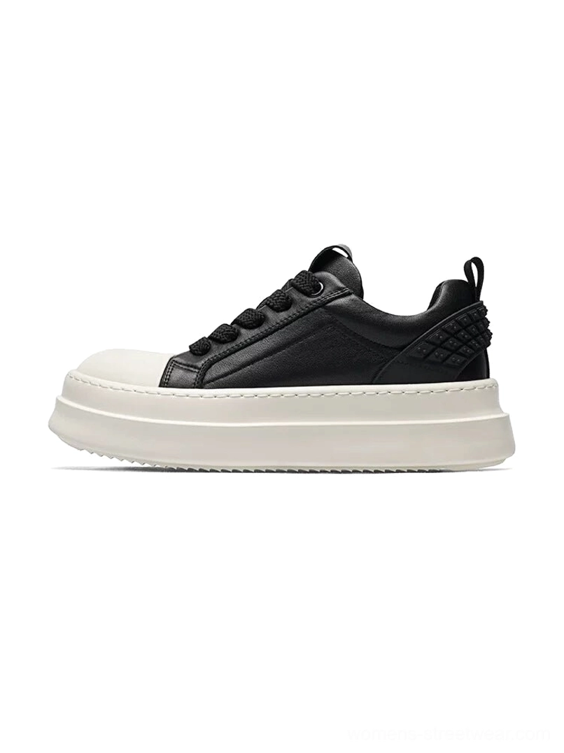Black leather platform sneakers with off-white chunky sole and quilted heel panel left side profile view