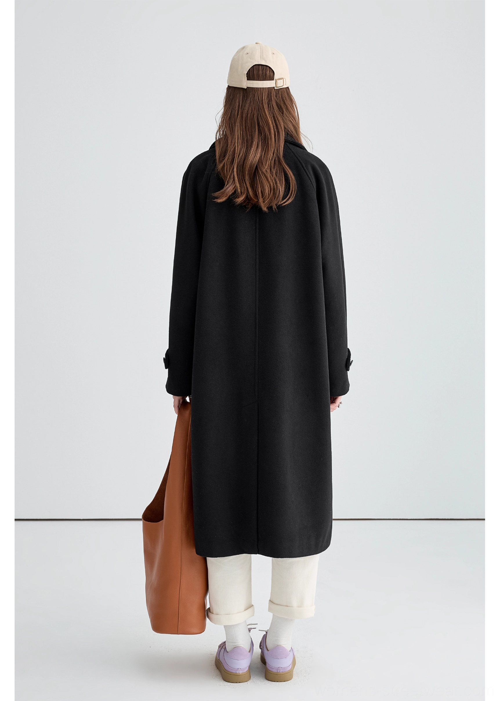 Black long insulated streetwear overcoat product image showing versatile black winter layering design