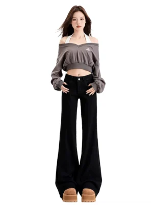 Black low-rise flared jeans for women with stretch denim, fitted upper, long bell-bottom leg, and Y2K streetwear silhouette