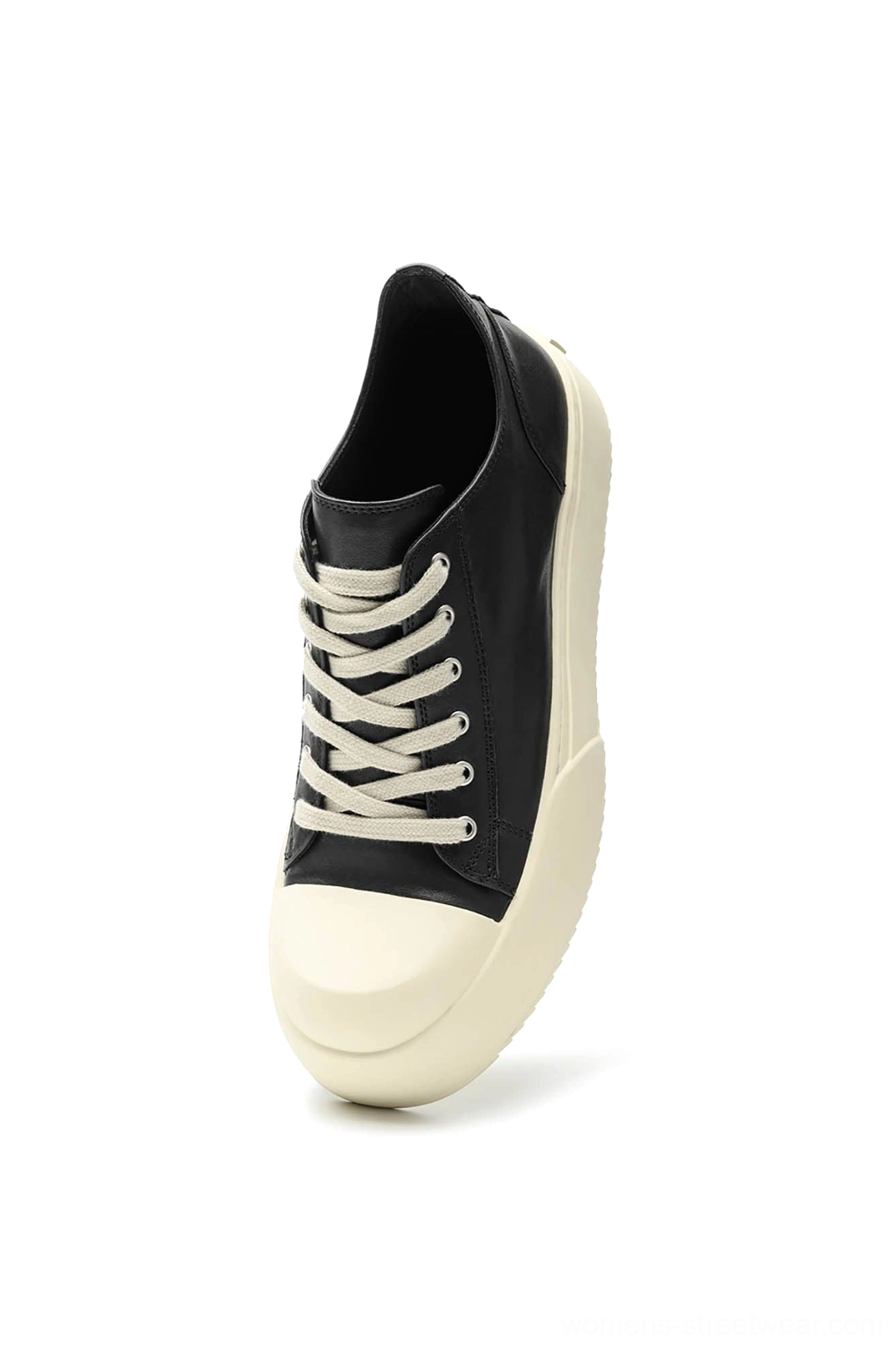 Front three-quarter view of black low-top leather platform sneakers with white flat laces and contrasting rubber midsole