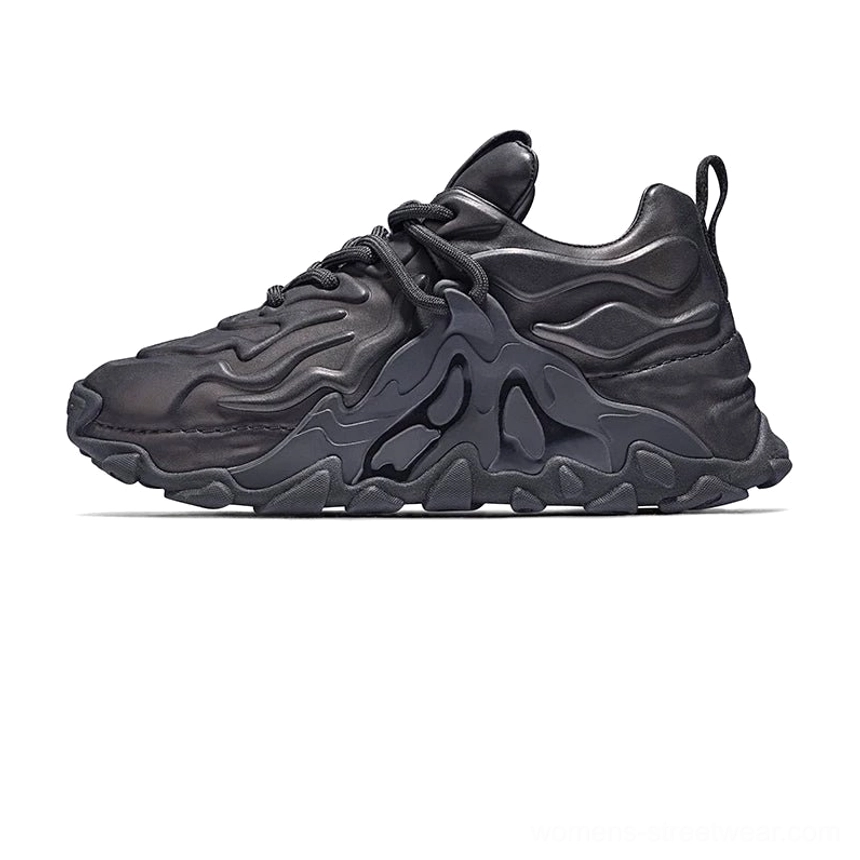 Black MagmaFlow chunky sneakers in side profile with a matte leather upper detailed with sculpted waves and a bold street-ready sole
