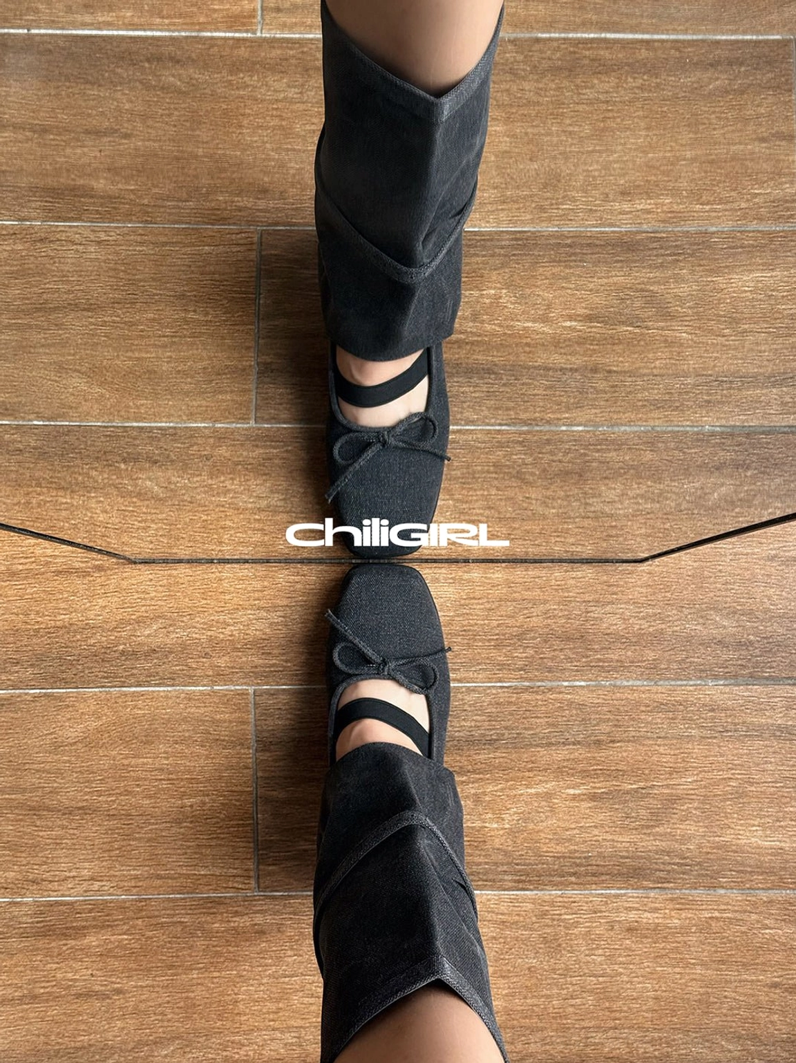 Top view of black denim Mary Jane mid-calf boots showing adjustable straps, square toe and decorative bow