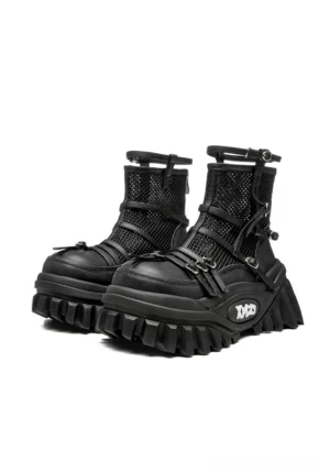 Black mesh-cuff platform combat boots with layered laces, buckle straps, genuine leather panels, and deep lug soles front angled pair view
