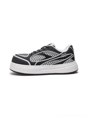 Black and white mesh-panel platform derby sneakers shown in a clean side profile with honeycomb textile upper, contrast graphic piping, lace-up derby front, and thick white raised rubber sole