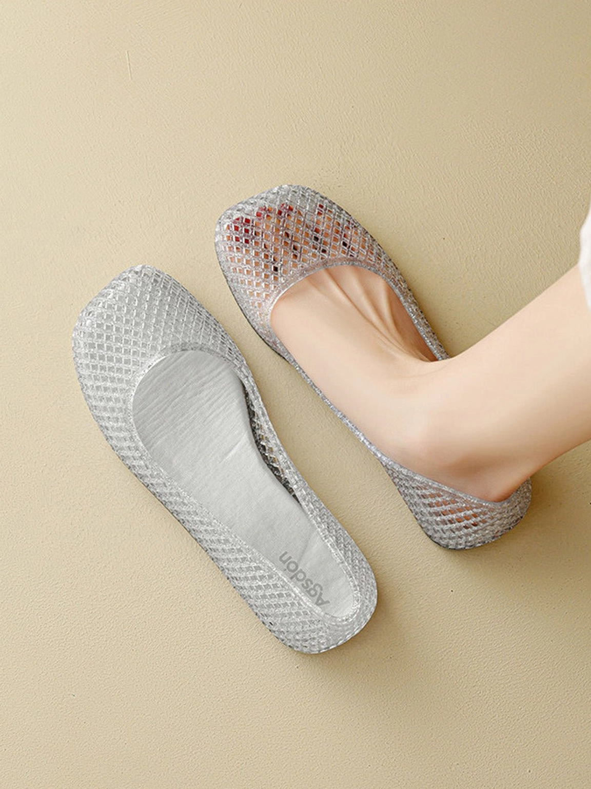 Black and metallic glitter mesh jelly ballet flats with rounded ballet-inspired silhouette