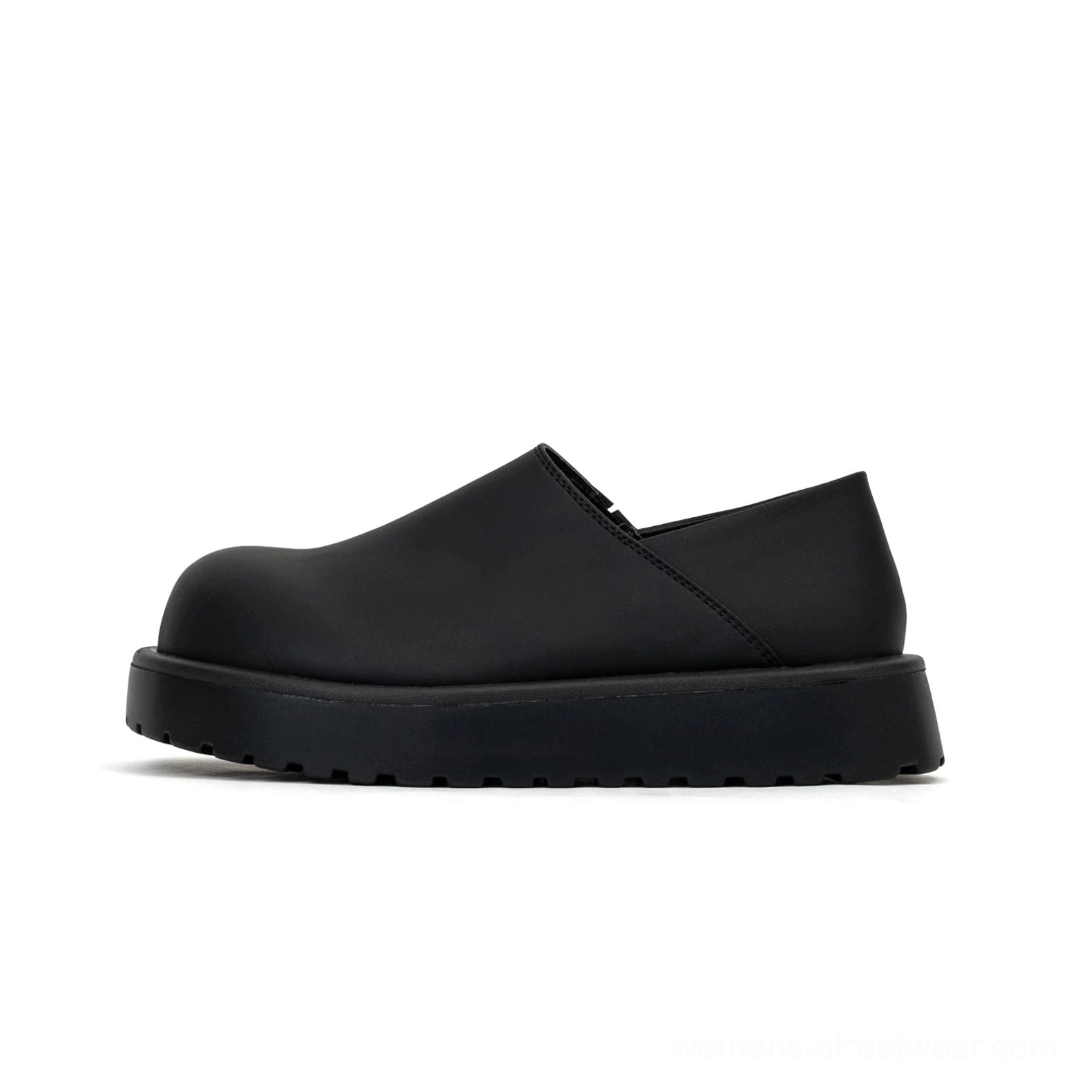 Studio side profile of black minimalist platform slip-on clogs with rounded toe and thick lug sole