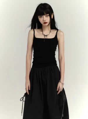 Black minimalist square neck camisole tank top worn with a black drawstring bubble midi skirt in a front studio view