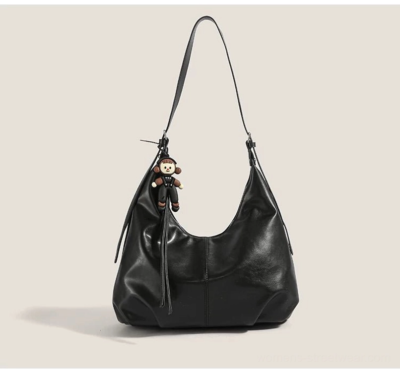 Black with pendant monkey charm crescent hobo shoulder bag with adjustable strap for Korean-inspired urban streetwear