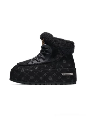 Black monogram faux fur platform ankle boots with chunky tread sole on white background