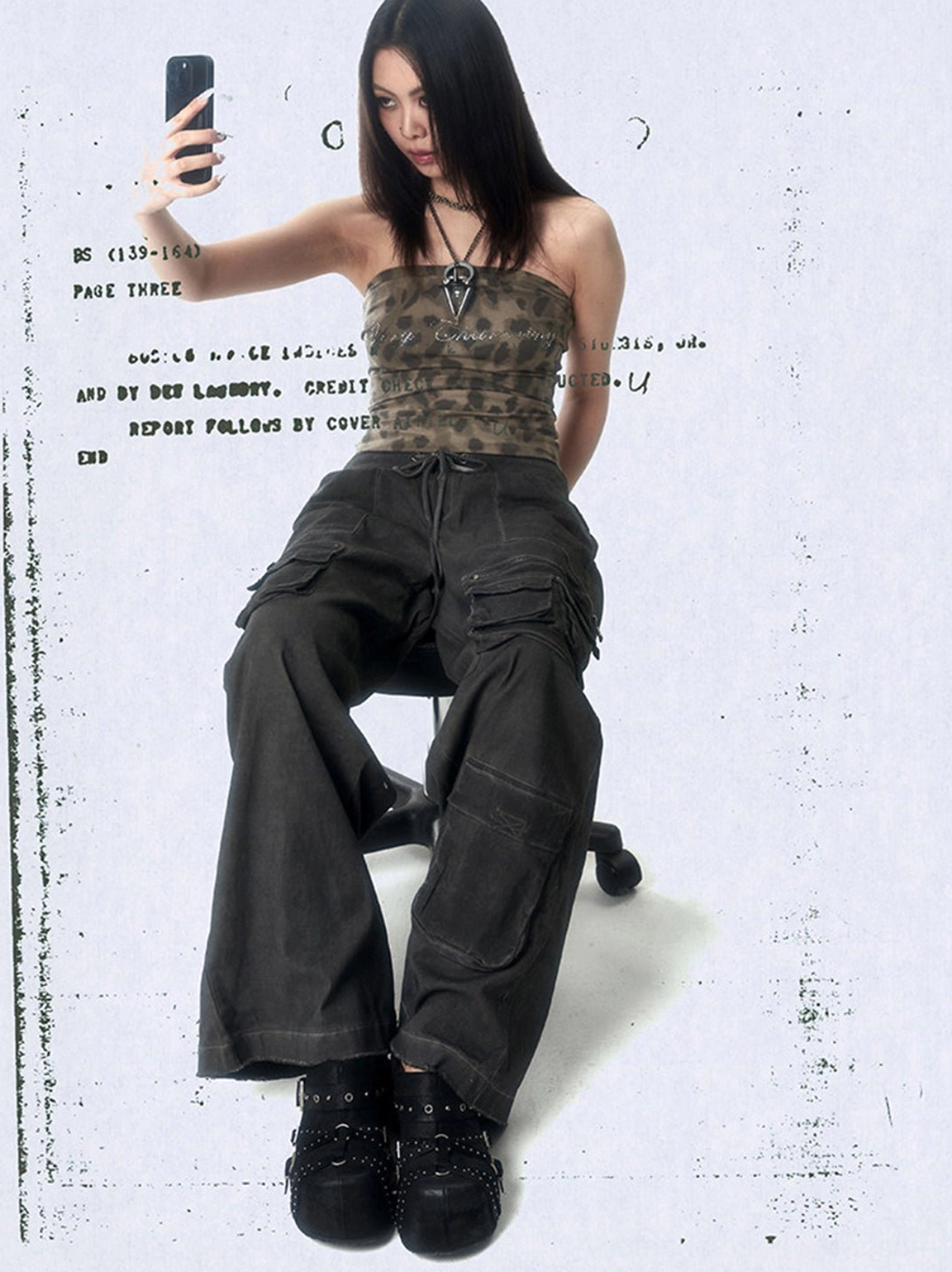 Full outfit view featuring black multi-buckle studded closed-toe mules and modern Y2K streetwear styling