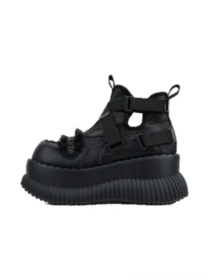 Left side view of black multi-buckle studded platform ankle boots with layered ankle straps, textured toe details, and a thick ridged sole