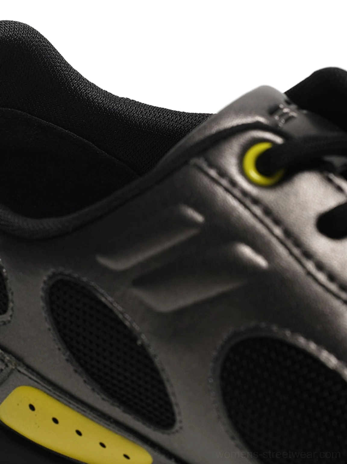 Retro black colorblock sneakers with gunmetal grey panels, neon yellow accents, mesh inserts, and a low-profile streetwear silhouette