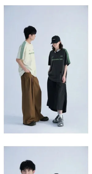 Black and off white contrast sleeve stripe T-shirts with green details on male and female models