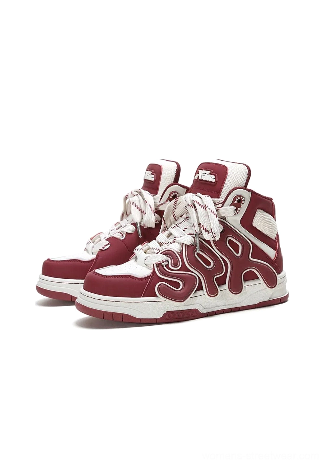 Pair of black and off-white high-top skate sneakers displayed on a white studio background with dimensional side letter appliques