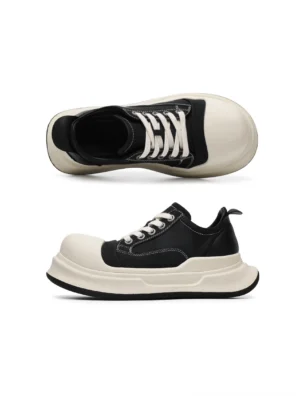 Top and side profile of black and off-white round toe platform sneakers showing the lace-up closure, padded low-cut collar, rear pull tab, and chunky sole
