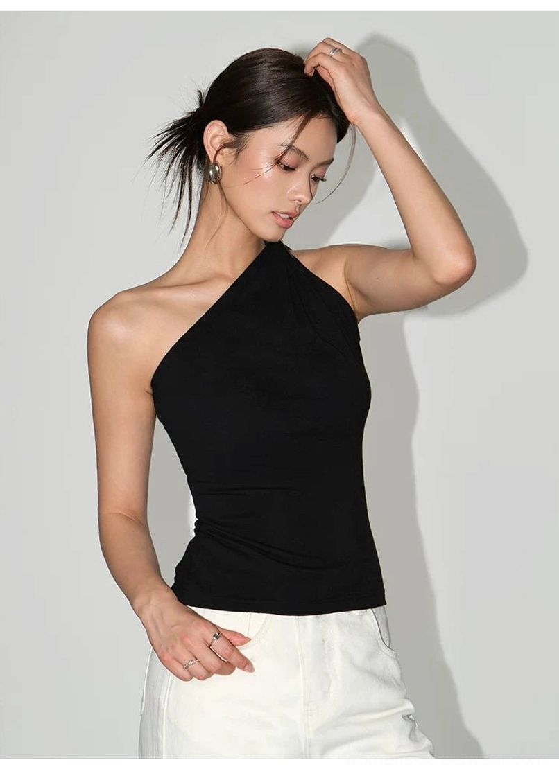 Black fitted one-shoulder knit tank top with twisted neckline and smooth knit texture shown in a modern streetwear portrait