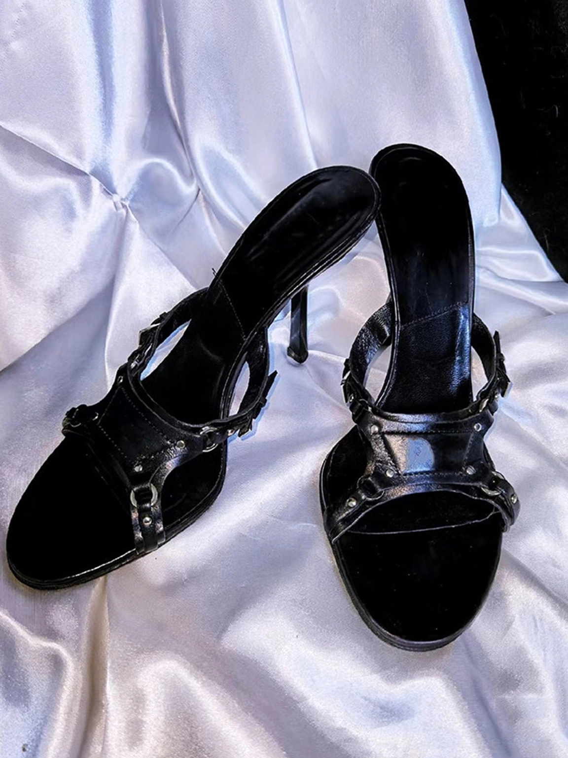 Black open-toe high heel sandals with suede-look toe detail, crossed metallic buckle straps, and slim 8cm stiletto heel