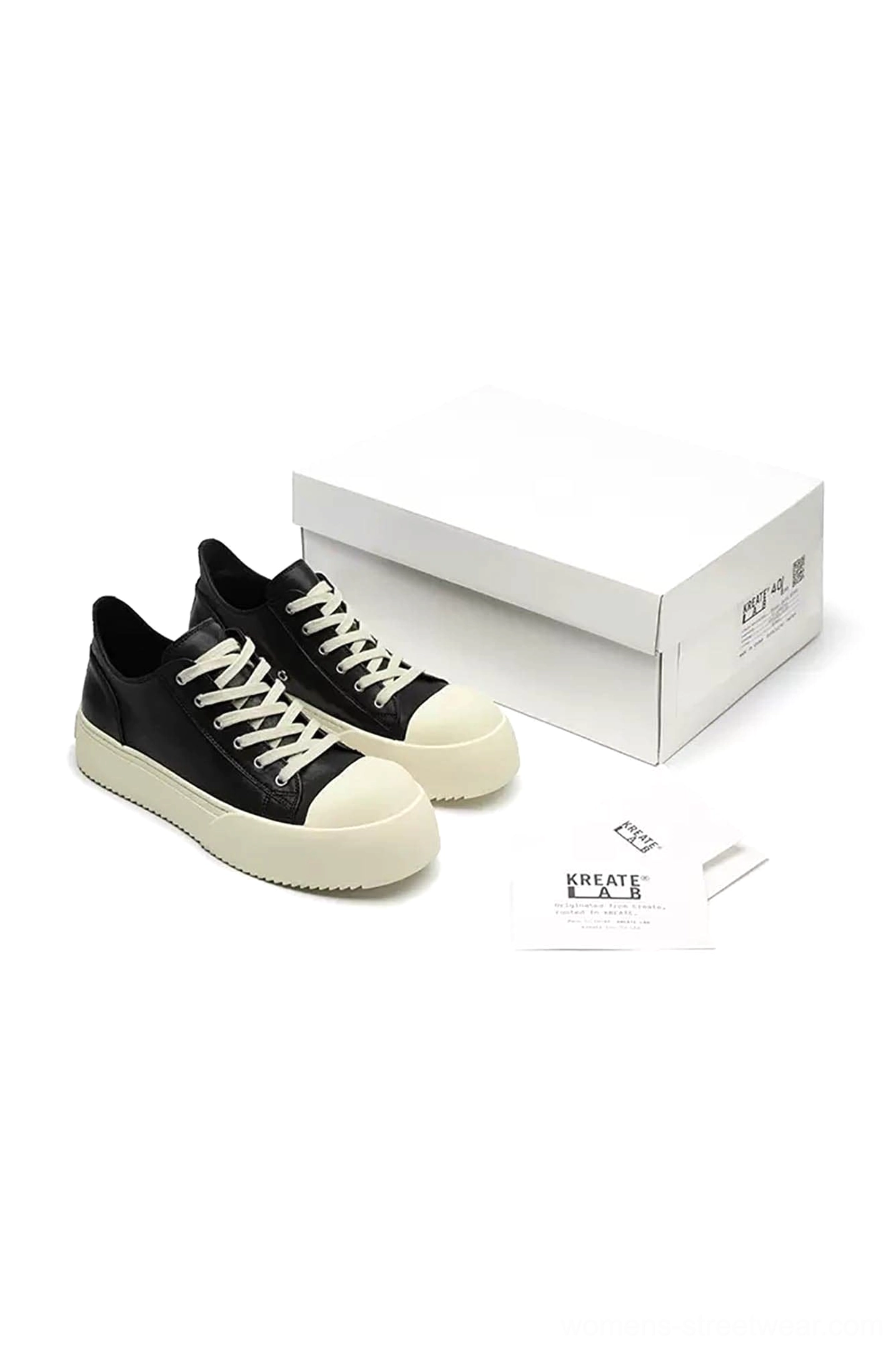 Black Oreo low-top platform sneakers displayed with matching shoe box and minimalist packaging