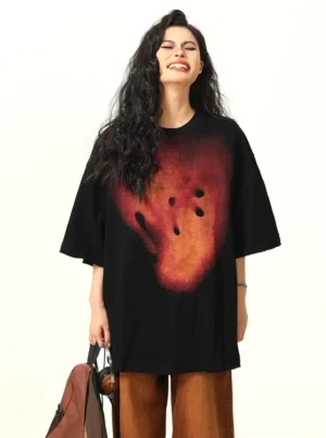 Black oversized abstract smiley graphic T-shirt front full body view with orange red gradient print