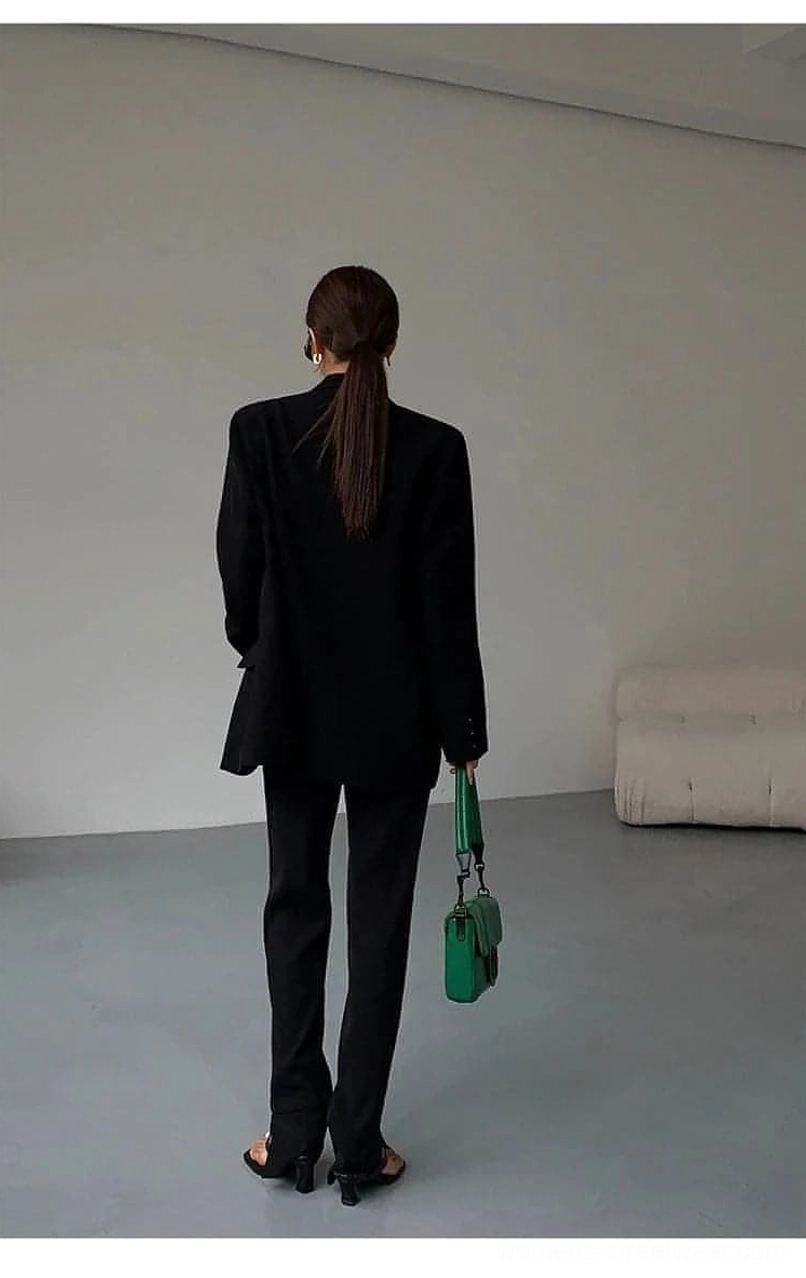 Black oversized blazer button placement single-breasted front closure detail examination
