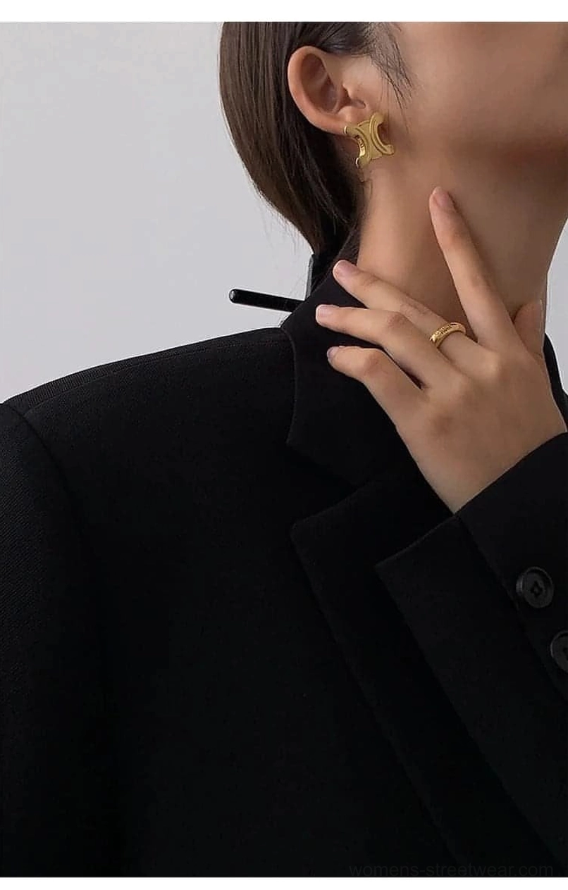 Black oversized blazer close-up neck collar ear details chunky gold hoop earrings styling