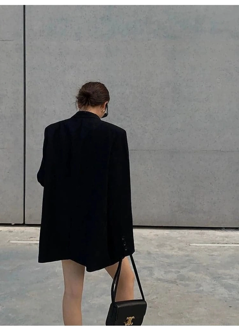 Black oversized blazer seasonal transitional piece spring summer fall wardrobe essential