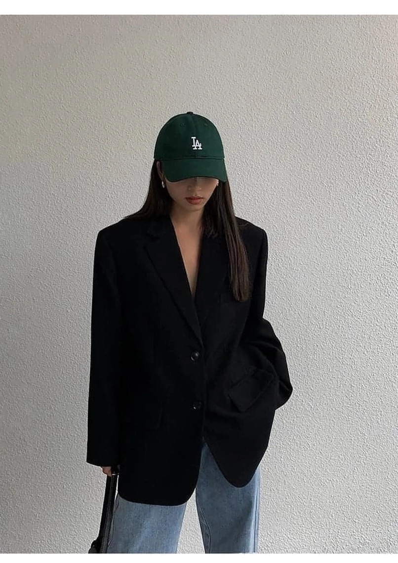 Black oversized blazer sleeve length display button cuff detail styling versatility