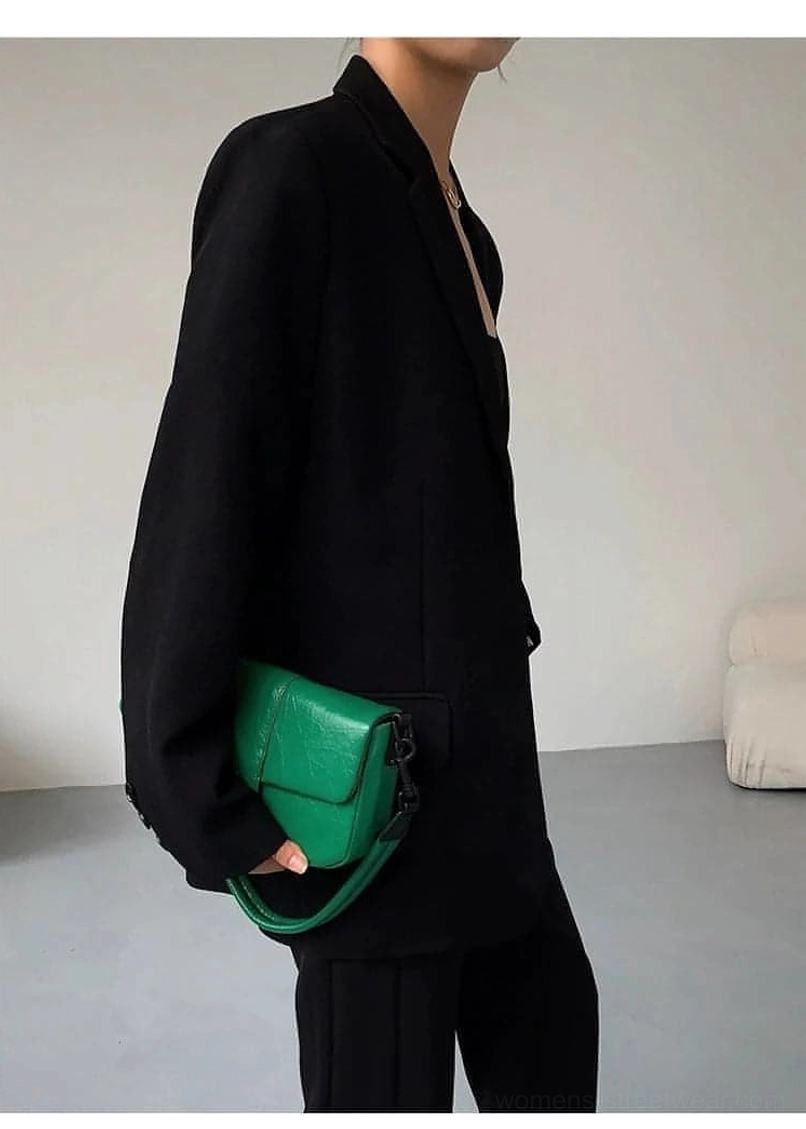 Black oversized blazer paired with tailored trousers business casual professional styling