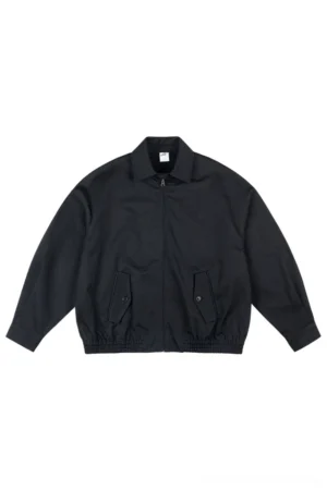 Black oversized cotton zip-up work jacket with pointed collar utility flap pockets and elasticated hem front view