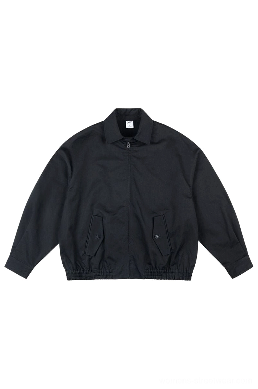 Black oversized cotton zip-up work jacket with pointed collar utility flap pockets and elasticated hem front view