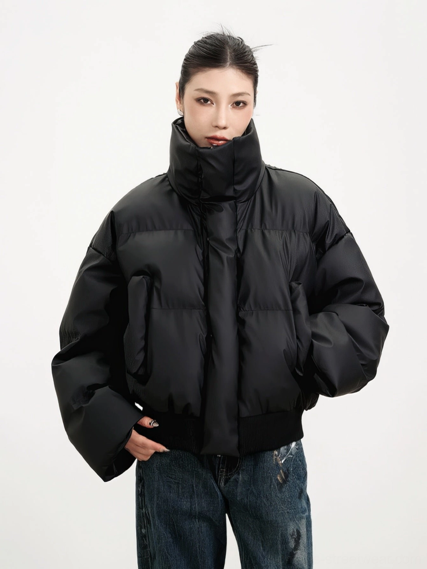 Black oversized cropped puffer jacket with dropped shoulders side pockets and relaxed Korean streetwear fit