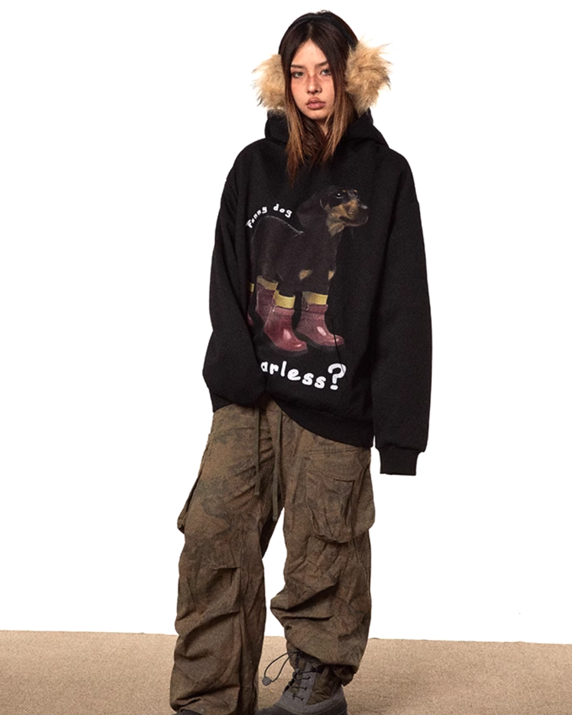 Full front view of a relaxed black oversized dog graphic hoodie with clear dachshund illustration, fearless slogan, and casual Korean streetwear styling