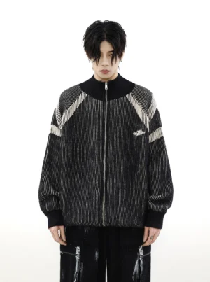 Front view of black oversized high-neck knit cardigan featuring full zipper closure, contrast shoulder stripes, and stand collar