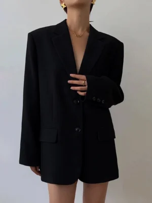 Black oversized Korean-style blazer full front body view studio shot minimalist streetwear tailoring