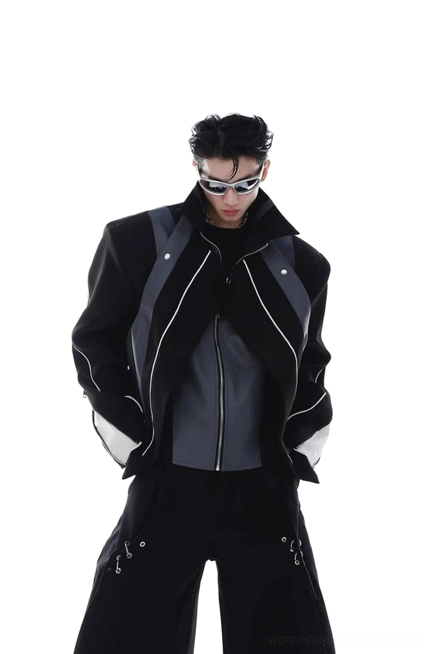 Black oversized layered PU leather biker jacket with dark gray contrast panels, exposed inner zipper layer, silver hardware, and structured shoulders