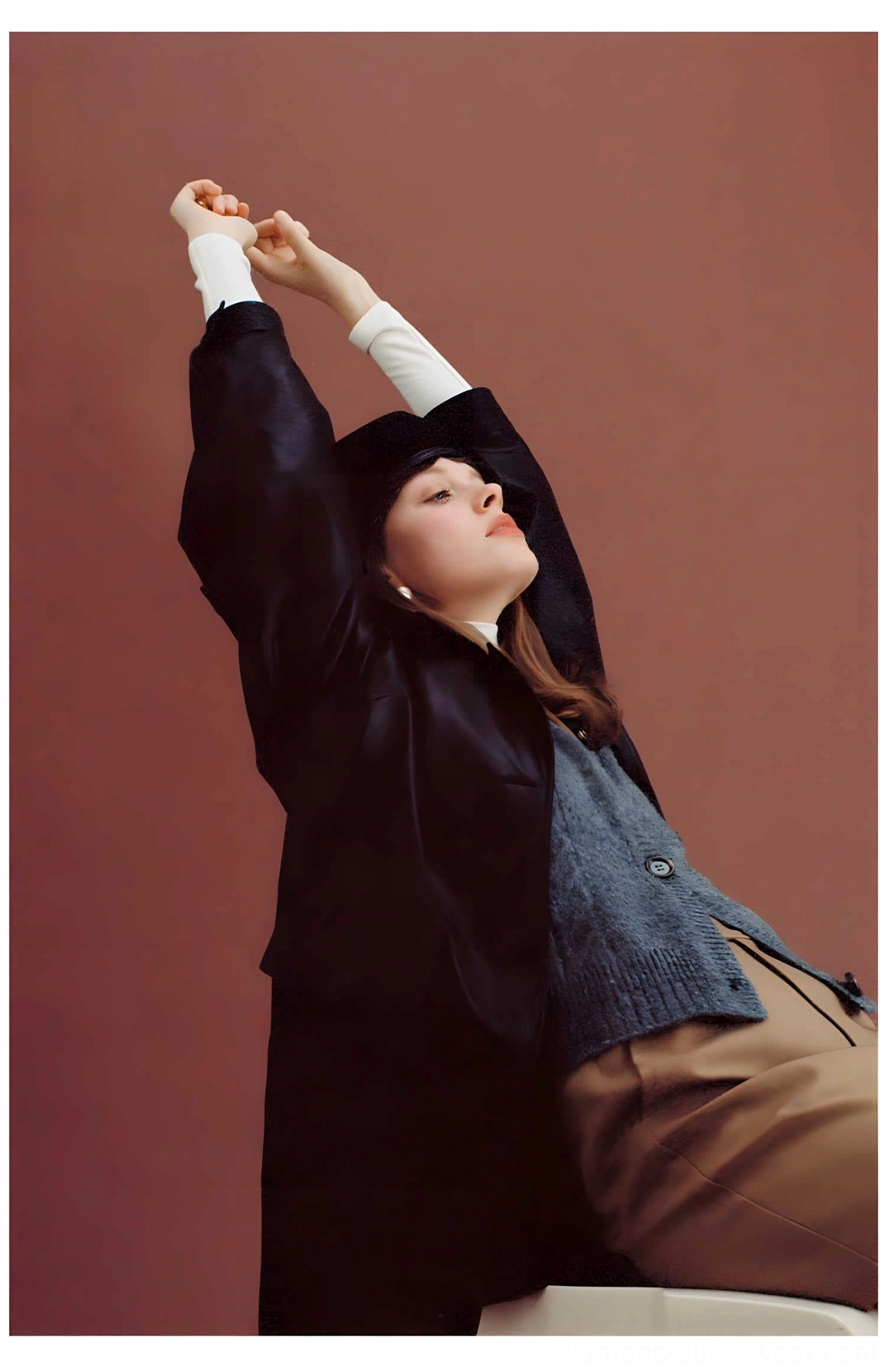 Black oversized PU leather moto jacket with retro utility pocket details in a modern women's streetwear style