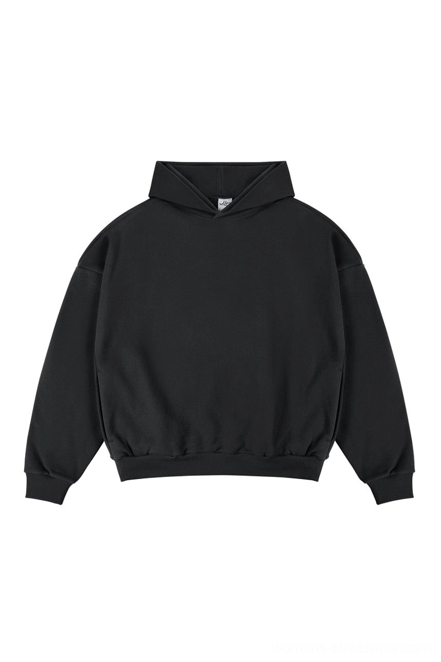 Black oversized unisex streetwear pullover hoodie with clean minimalist design ribbed cuffs and hooded neckline